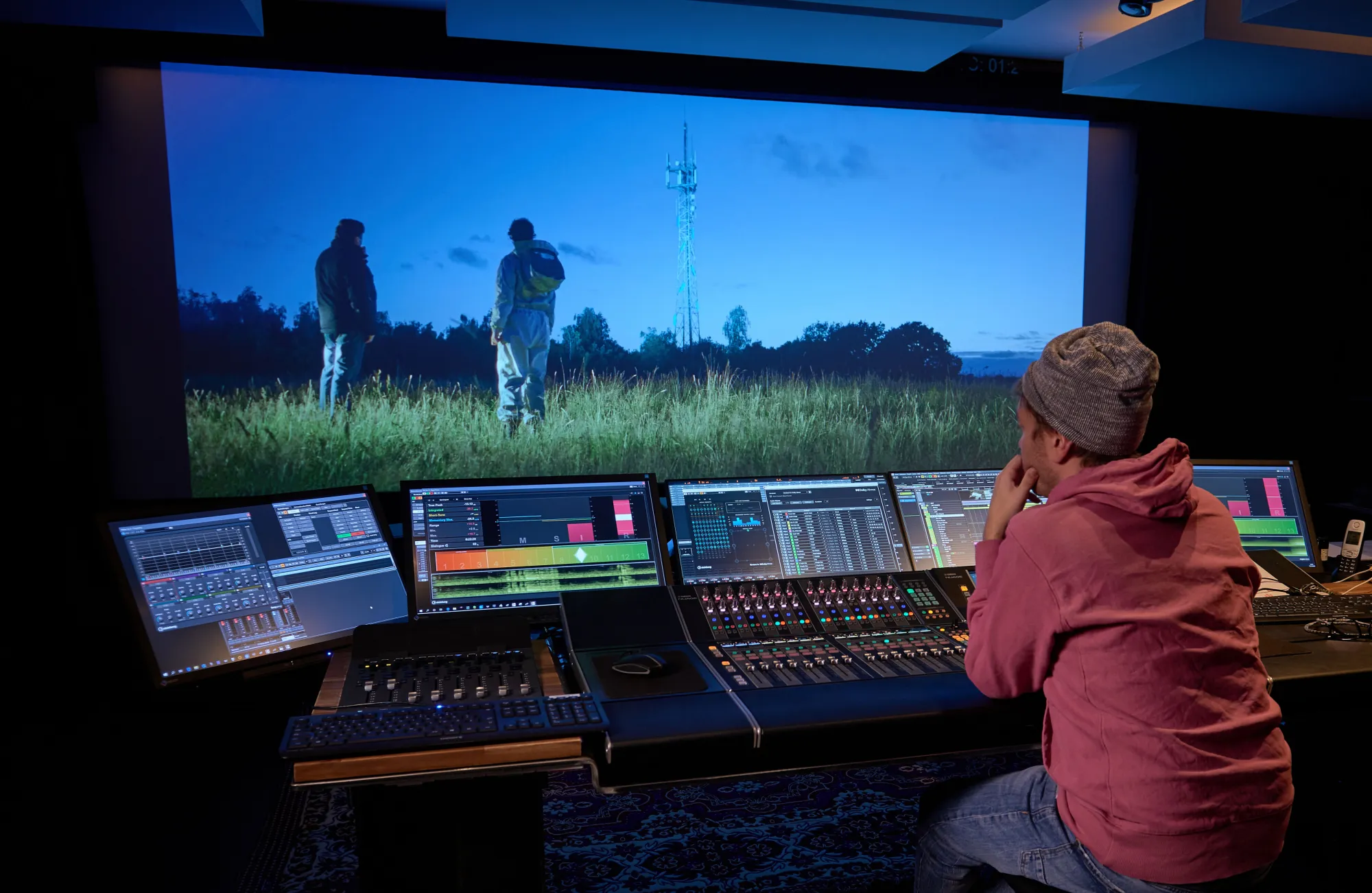 Audio post-production professional mixing a film scene in Nuendo